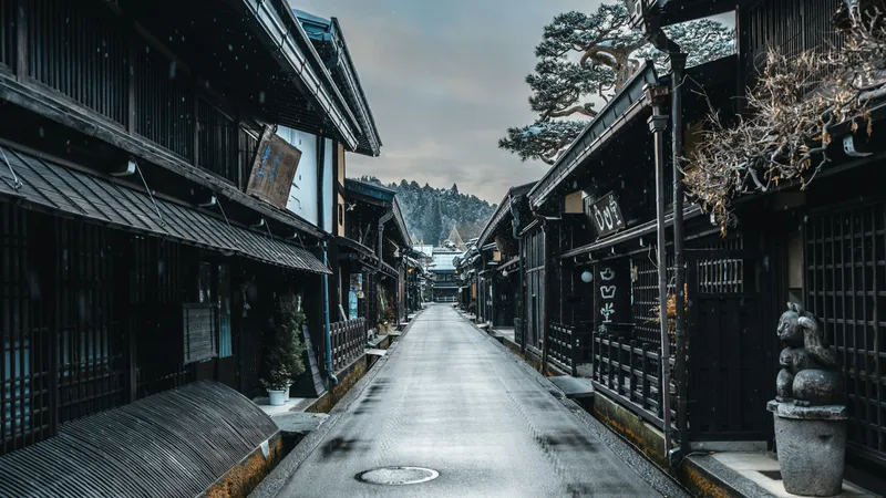 A snowy dusk street in Takayama's preserved Edo-period old town